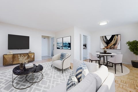 a living room with a couch and a table and a television